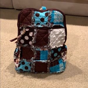 Adorable quilted backpack purse.